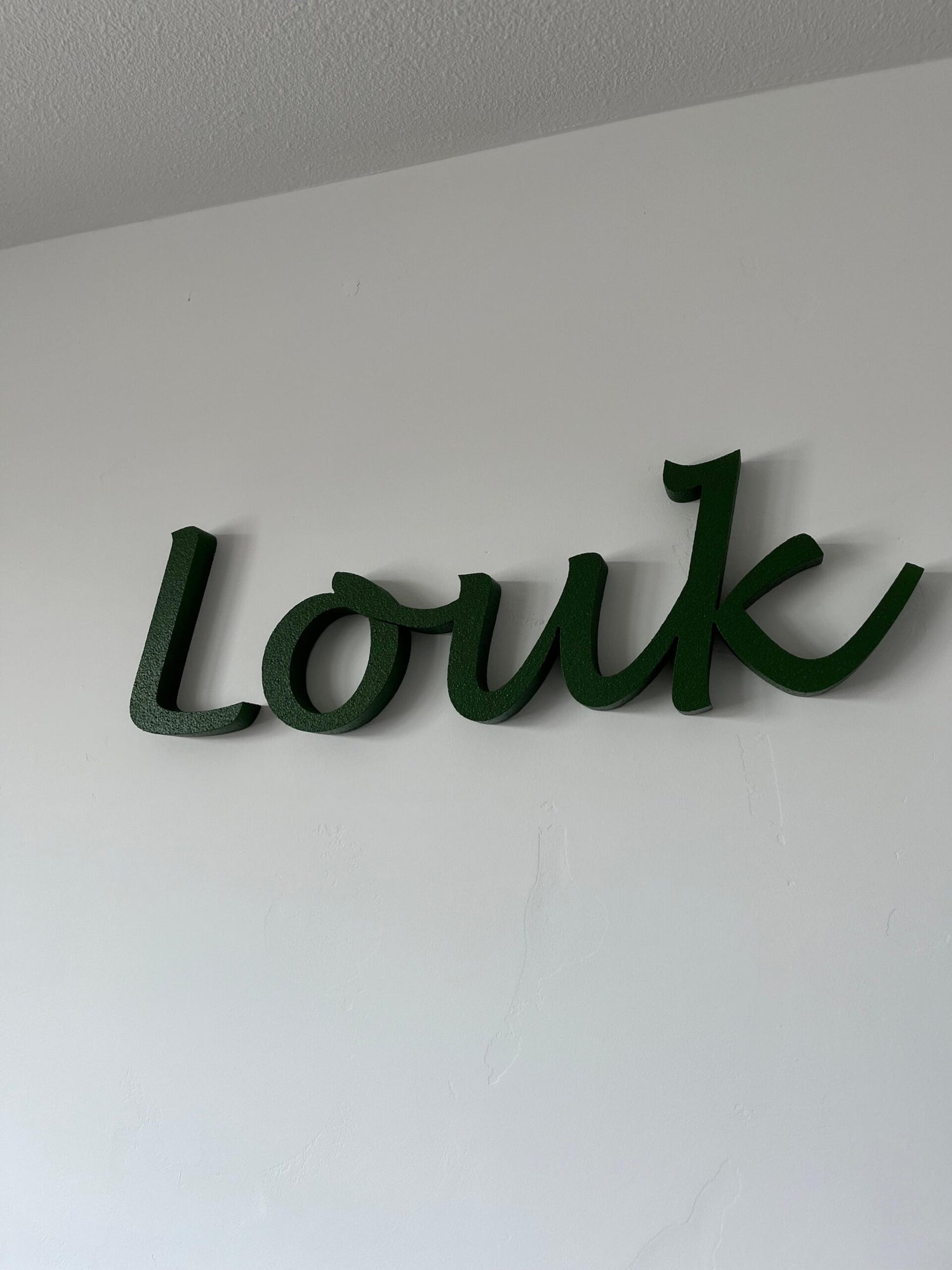 Louk letters on wall